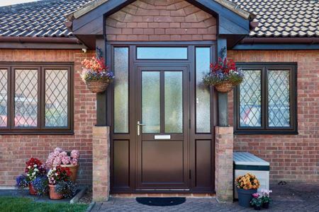 Brown Aluminium Porch Door Exterior with Dark Woodgrain Windows