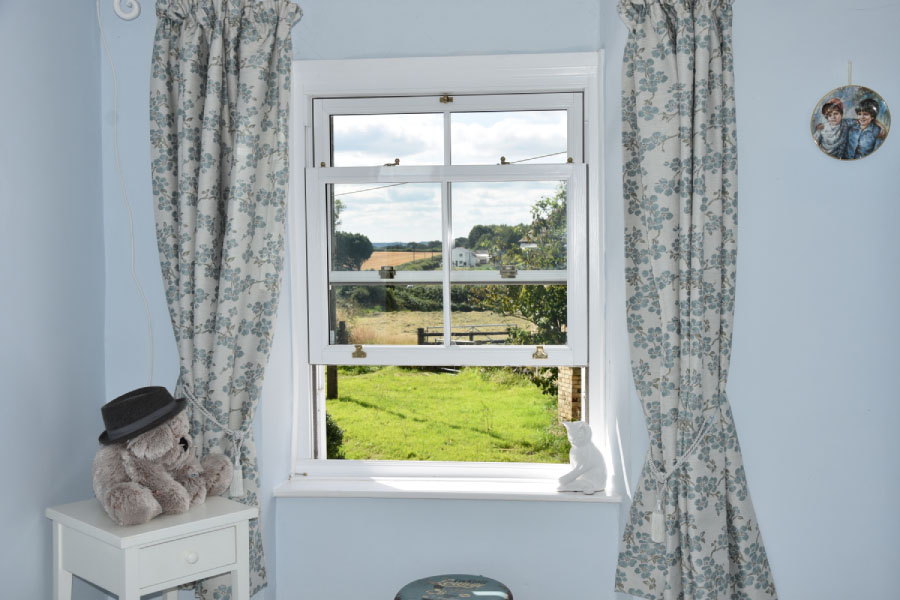 White uPVC Sash Window with Cottage Bars