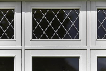 Close up of top hung casement with lead bars on a White wooden flush window from Anglian Home Improvements