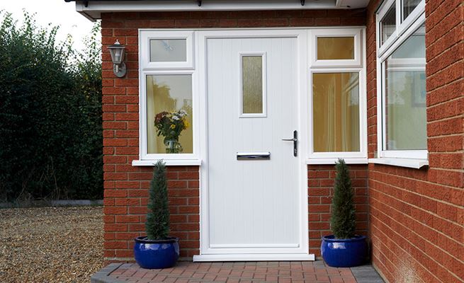 White composite front door with Cotswold glass and chrome handle and letterplate from the Anglian contemporary composite doors range