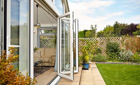 White bi fold doors in an Anglian extension