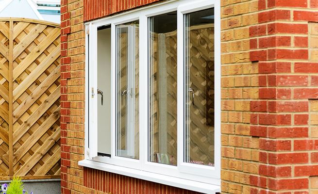 UPVC dining room double glazed window finished in White Knight from the Anglian casement window range