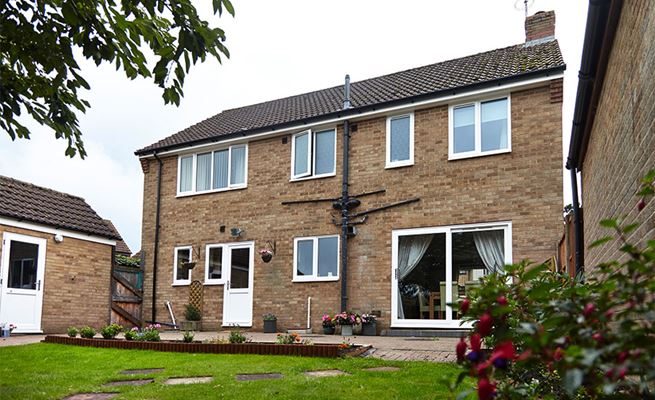 Full house renovation with White UPVC double glazing back door and sliding patio door from Anglian Home Improvements