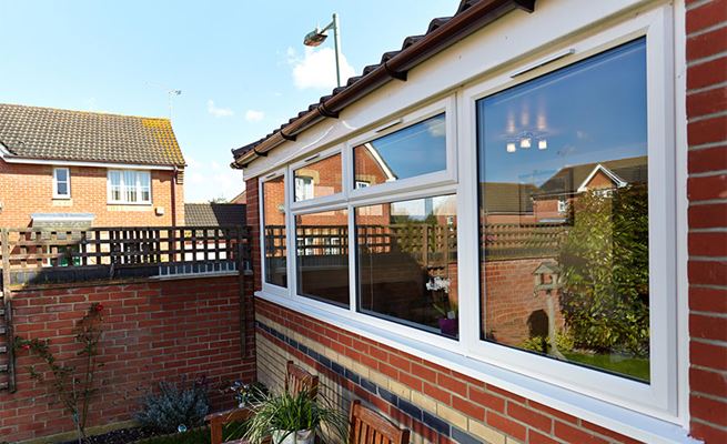 New extension with White UPVC double glazed casement windows and fascia boards with black guttering from Anglian Home Improvements