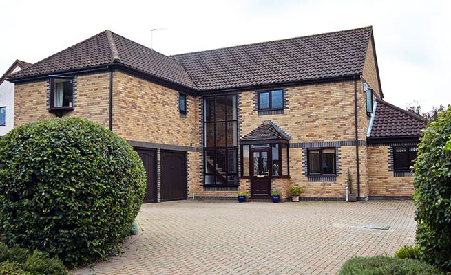 Whole house double glazed UPVC casement windows in Dark Brown from the Anglian UPVC windows range