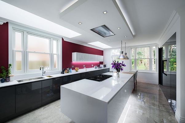 Contemporary kitchen with White UPVC sash windows that vertically slide from the Anglian sash window range