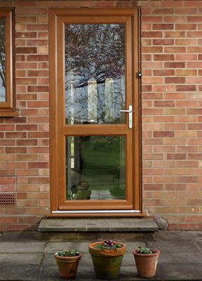 UPVC back door with clear glass finished in Golden Oak with double glazing from Anglian Home Improvements