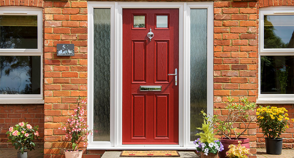 Red Composite Front Door With Two Small Glazed Top Panels in a Six Panel Design with a Chrome Knocker and Handles