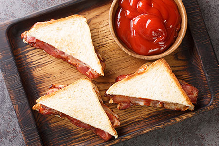 Brown-sauce-or-red-sauce-on-a-bacon-sandwich