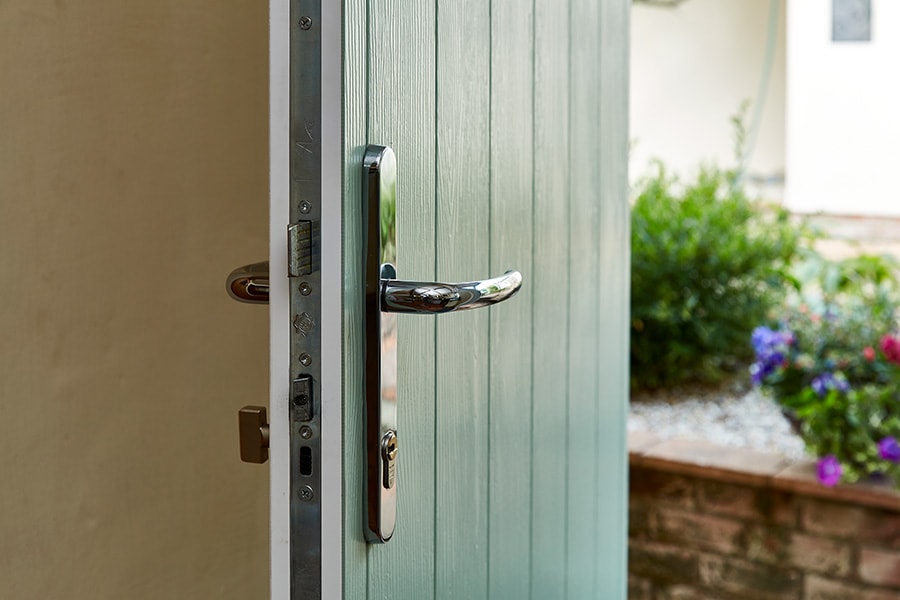 Sage green composite door with tongue and groove panel