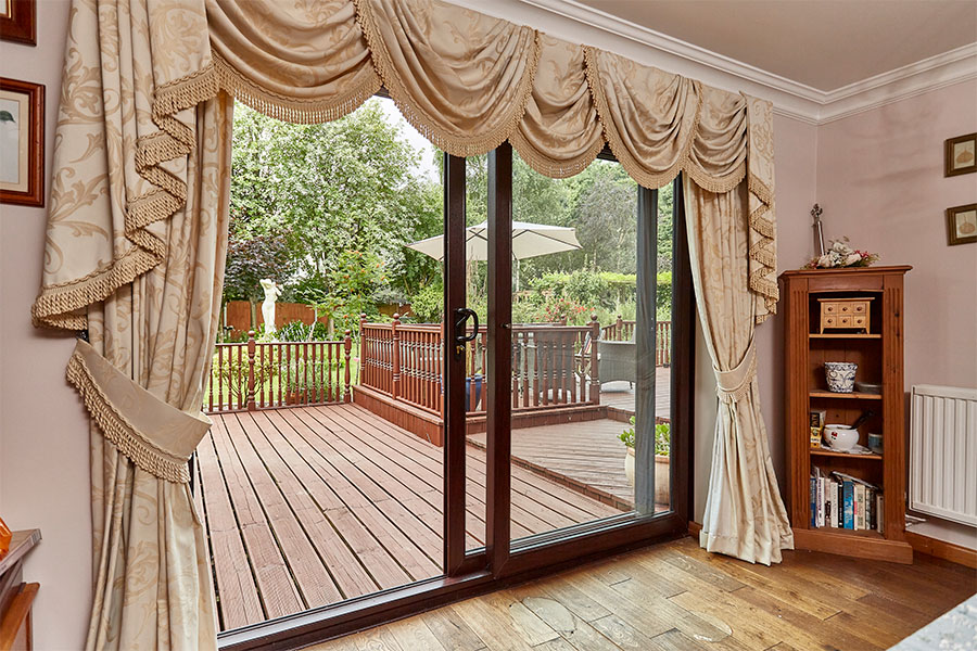 Dark woodgrain uPVC sliding patio door interior in open position