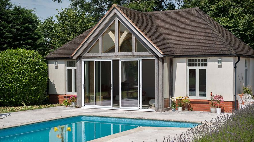 White patio doors back house with pool