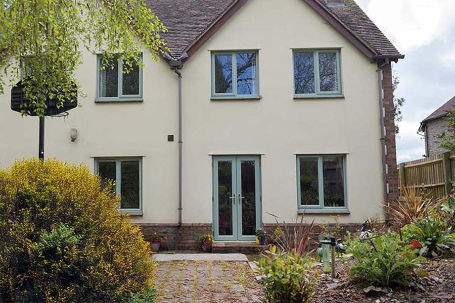 uPVC French doors and casement window in sage green
