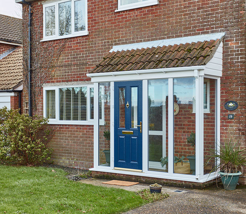 White PVC pitched roof porch with GRP Classic Winchester dual steel