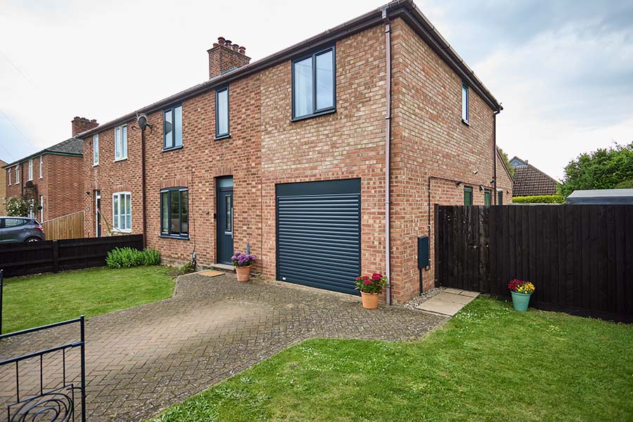 Aluminium roller garage door triple glazed casement winodow back door anthracite grey