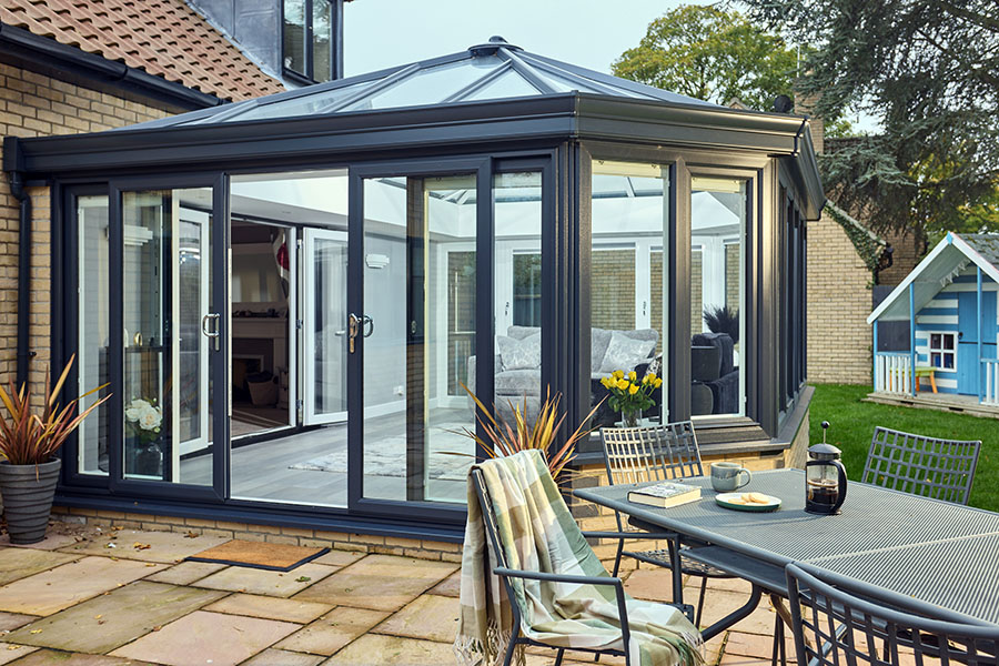 Dual Anthracite grey uPVC Edwardian conservatory with sliding patio doors