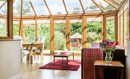 Edwardian uPVC conservatory finished in Golden Oak woodgrain from the Anglian Edwardian conservatory range