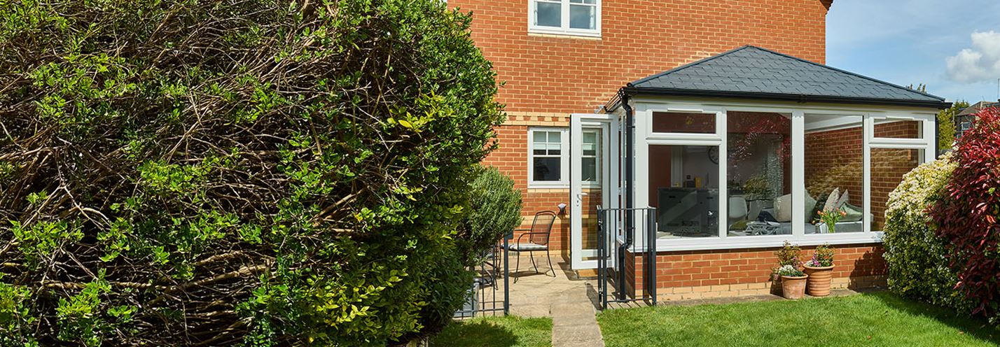 White Knight uPVC Edwardian conservatory with replica carbon grey tiles