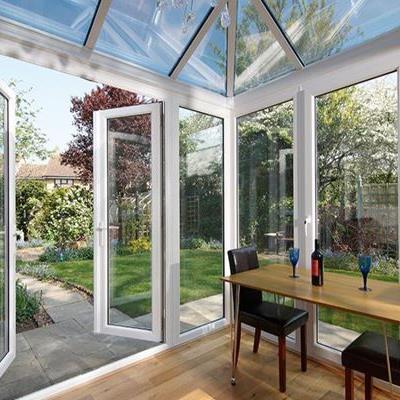 UPVC glass roof conservatory finished in White with large casement windows and French doors opening onto garden