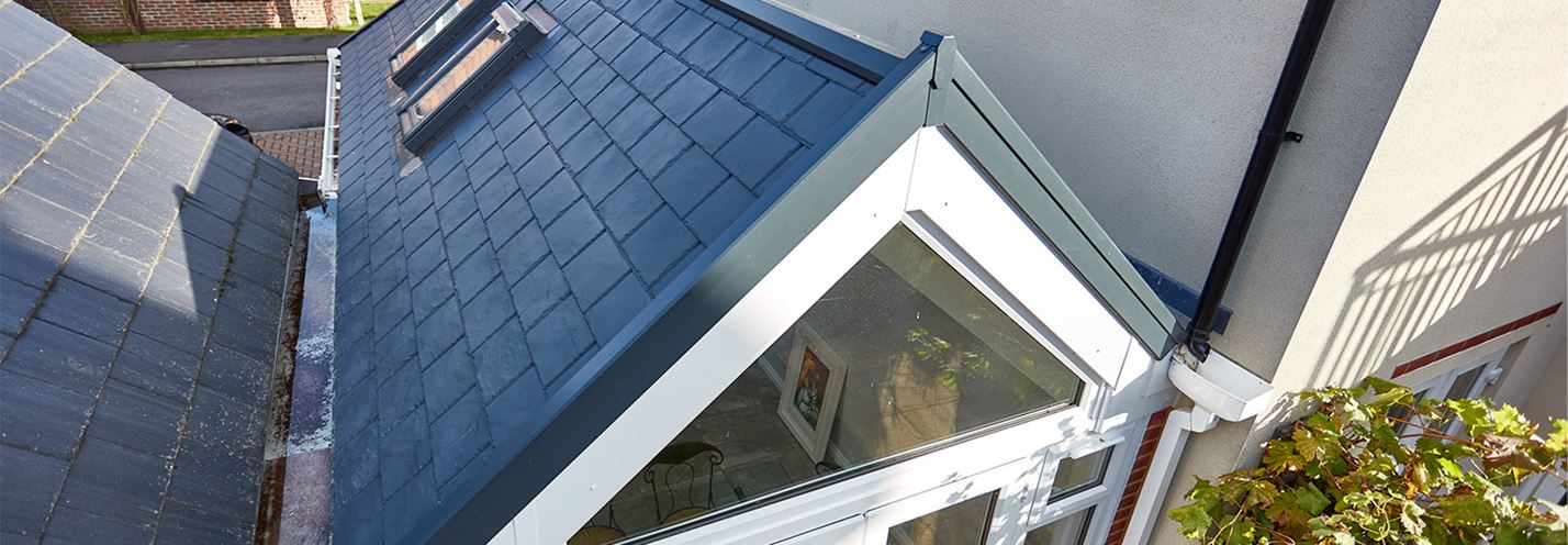 Anthracite grey replica tile extension with triangle window close up banner