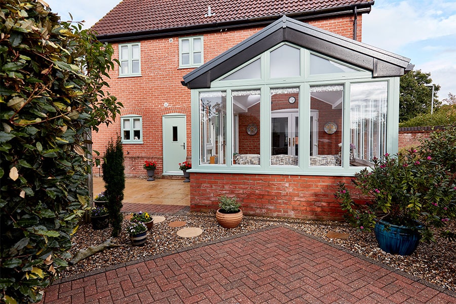 Dual sage green replica tile extension with triangle window extererior
