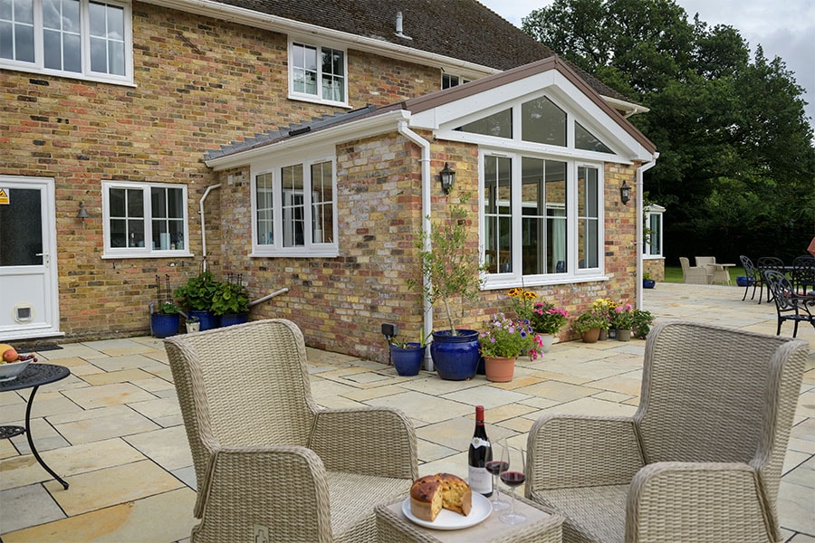 White uPVC extension with triangle glass
