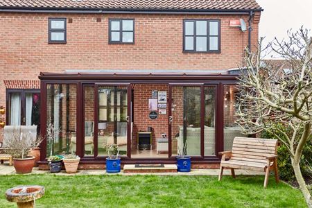 Dark woodgrain uPVC lean to