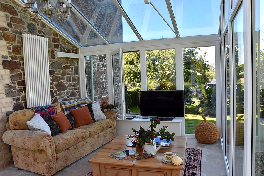Dual sage green L Shaped conservatory interior