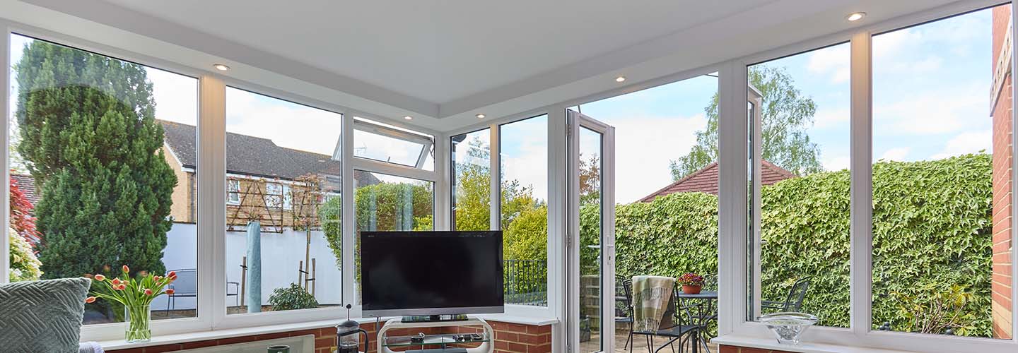 Edwardian uPVC white conservatory with replica grey tiled roof
