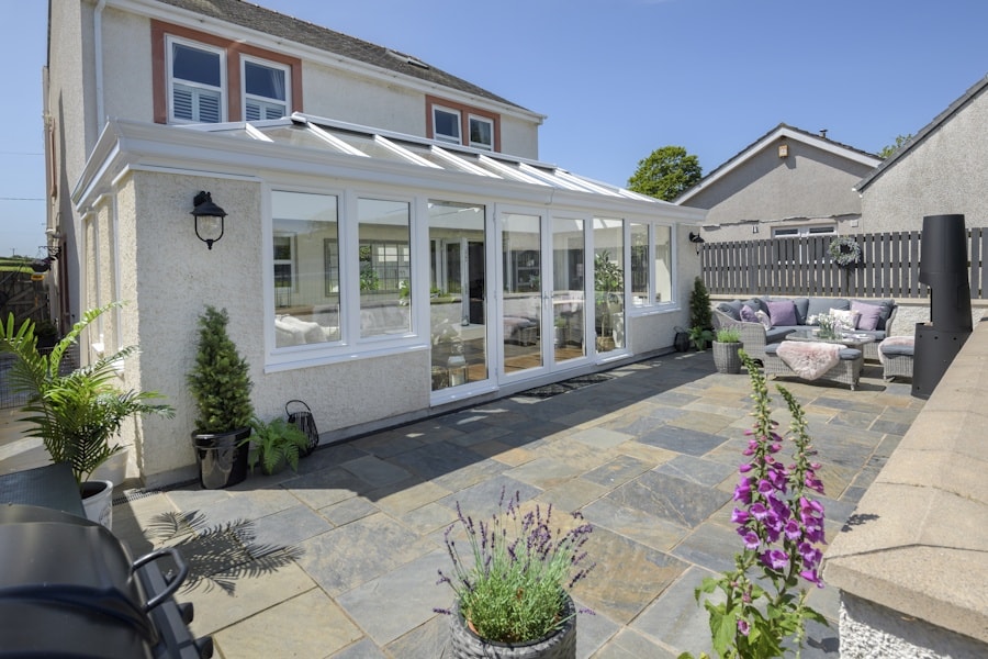 Classic white Orangery with white uPVC French doors and Tilt and Turn windows