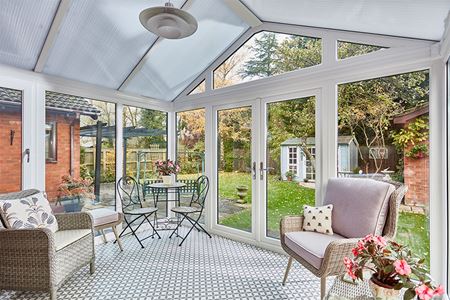 White uPVC Rengency conservatory with French doors and Polycarbonate roof interior