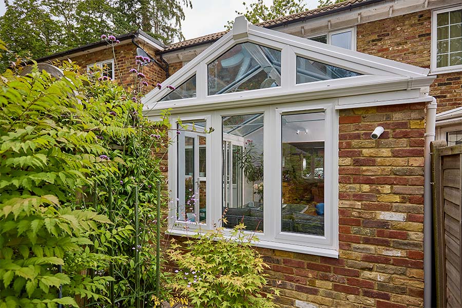 uPVC and brick regency conservatory with traingle window section