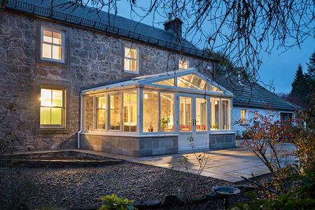 White uPVC regency concervatory at evening