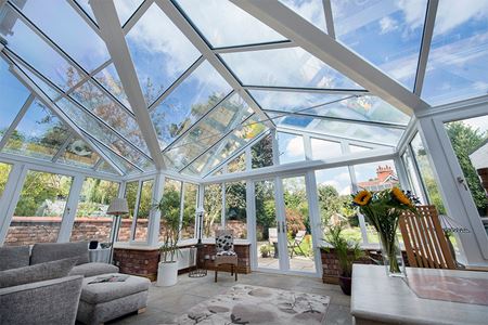 White uPVC T Shaped Harmony conservatory with French doors and tilt and turn windows interior