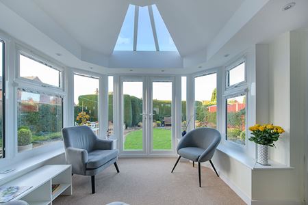 White uPVC stretched Victorian conservatory with French doors interior