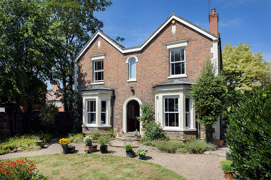 White uPVC bargeboard with sash and bay windows whole house
