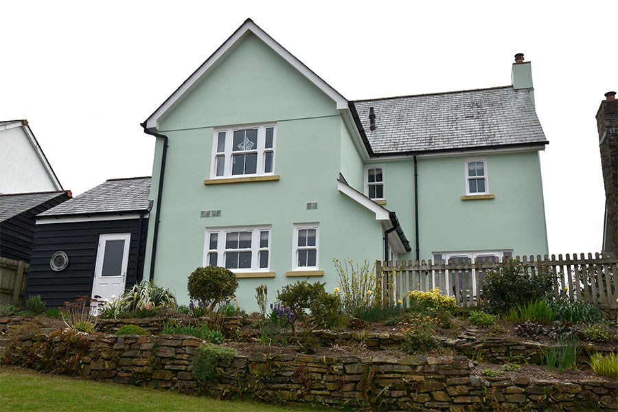 White uPVC bargeboard with white windows and cottage bars whole house