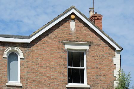 White uPVC bargeboards and white sliding sash windows