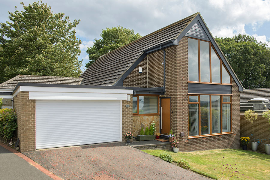 uPVC anthracite grey shiplap cladding with golden oak windows whole house