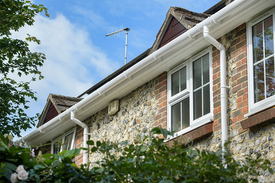 White uPVC soffit and fascias and guttering with casement windows
