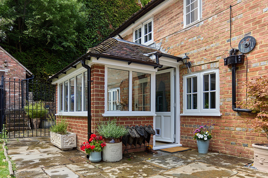 Black uPVC guttering with white back door