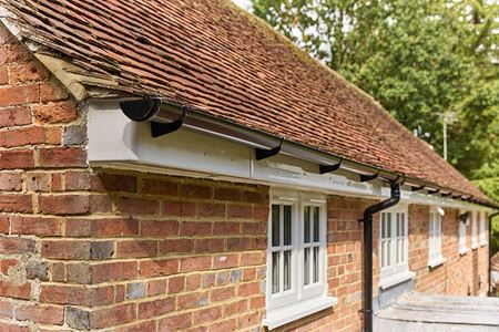 Black uPVC half round guttering close up