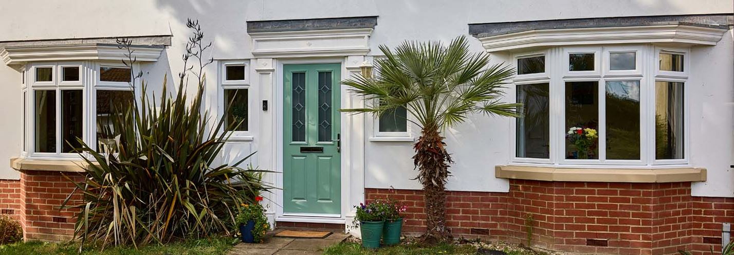 Dual sage green composite door and uPVC bay windows banner