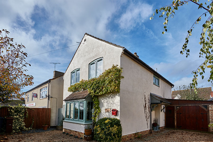 uPVC bay window and casement windows with Georgian inserts in sage green whole house