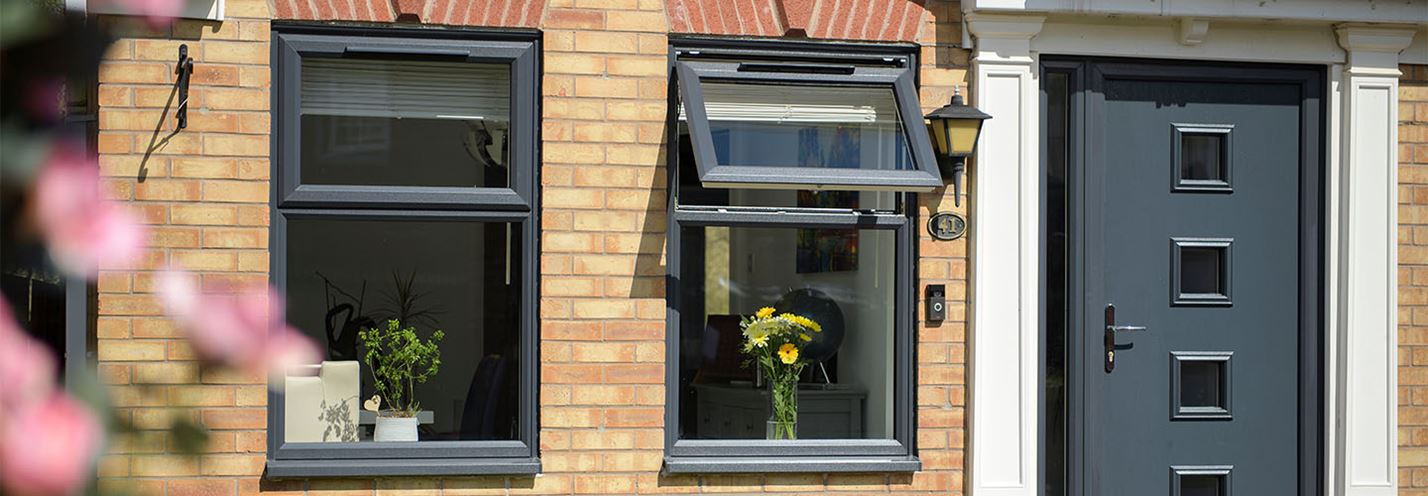 Anthracite grey uPVC top hung casement and front door energy efficiency banner