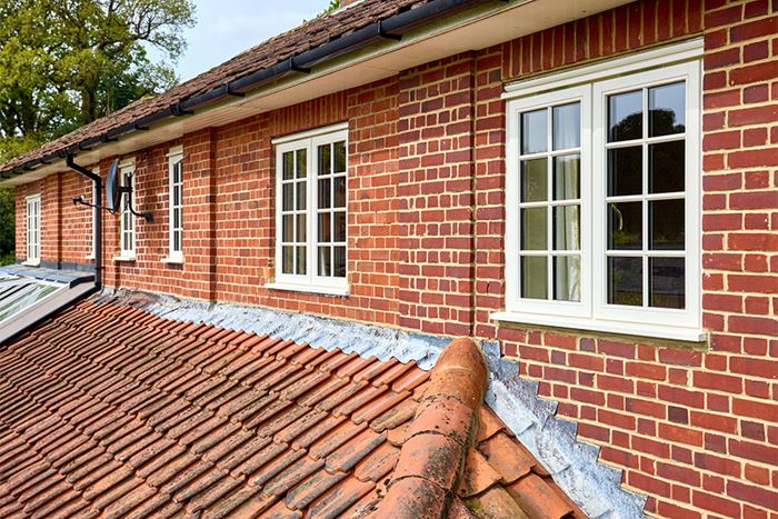 Cream wooden casement windows with Georgian insert bars