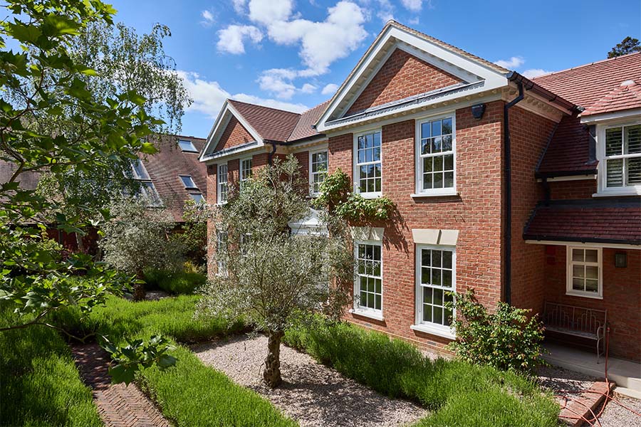 White uPVC sash windows with Georgian bar inserts whole house
