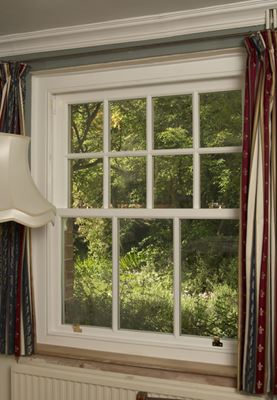 Interior view of white double glazed wooden sliding sash window with cottage bars from the Anglian sash window range