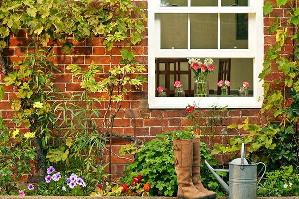 White timber sliding sash window with cottage bars and double glazed glass from the Anglian sash window range